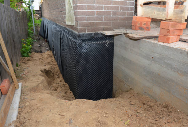Happy homeowners after waterproofing job in Glandorf